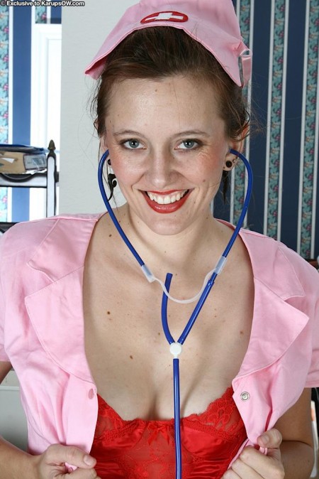 Justine Anilos in pink nurse uniform has a good time playing with her pussy